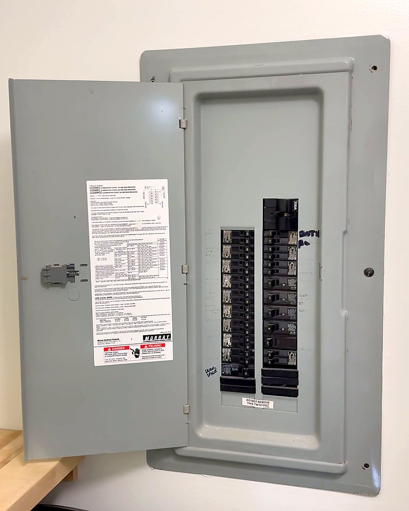 An open gray breaker panel before any labels are applied